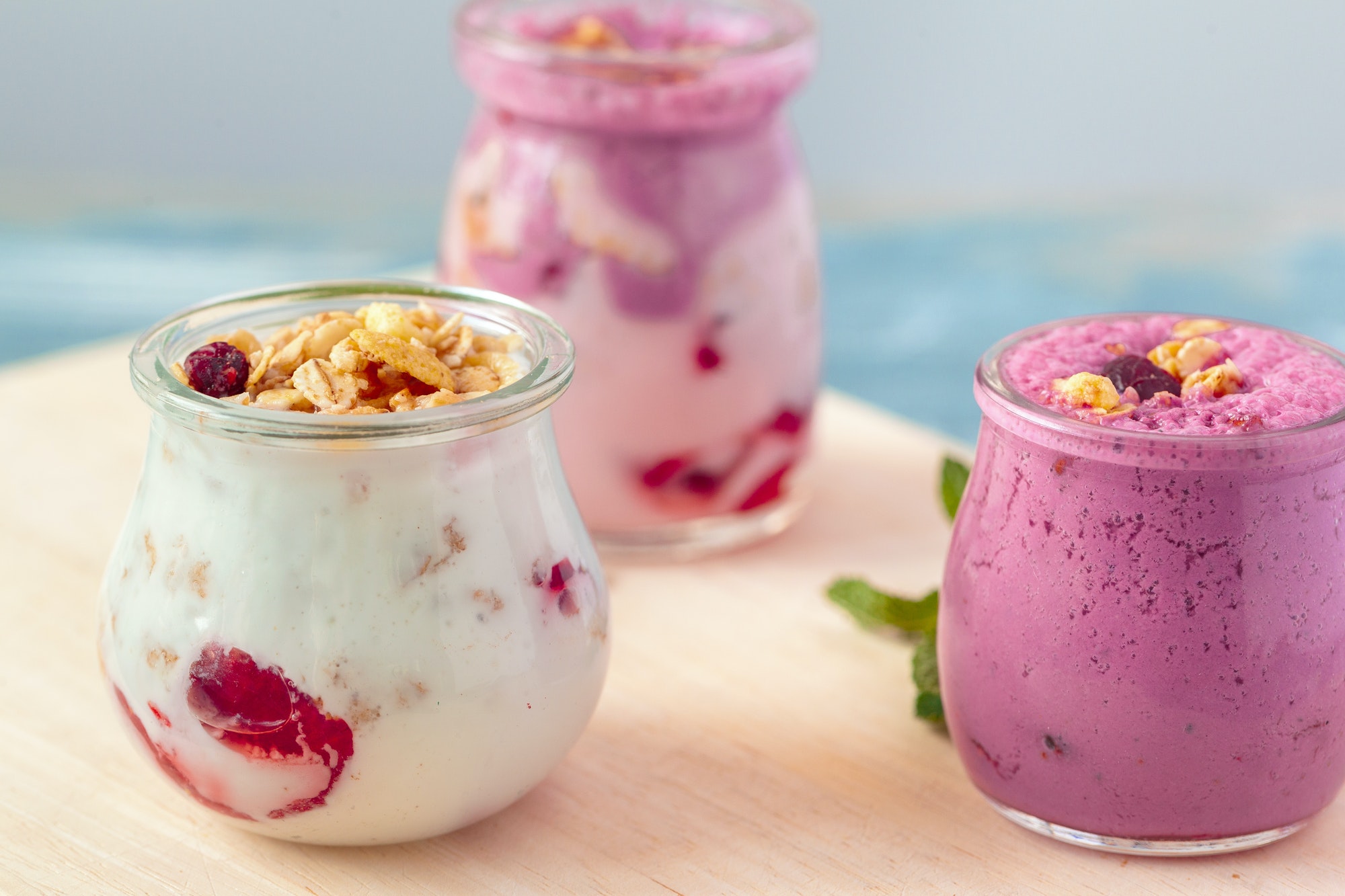 Granola with yogurt and berries for healthy breakfast on a table